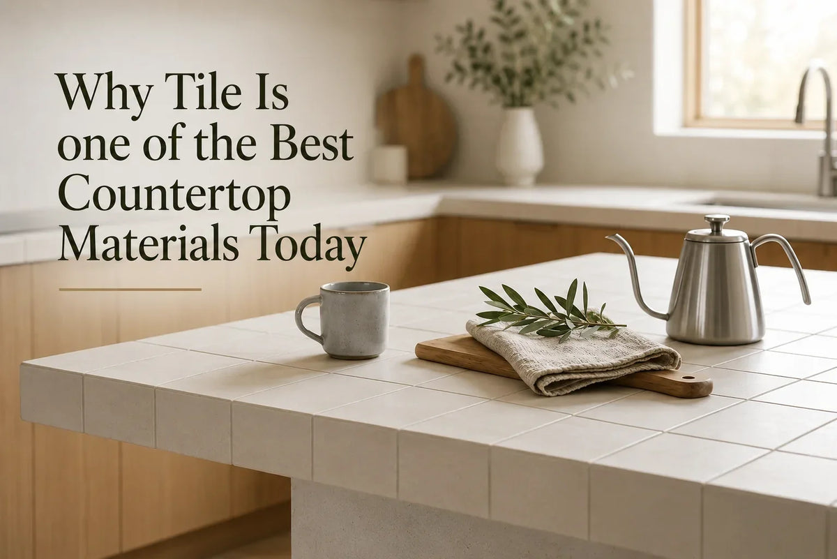 White tiled kitchen countertop with wood cabinetry, natural light, and minimalist décor, illustrating tile as a durable and stylish countertop material.