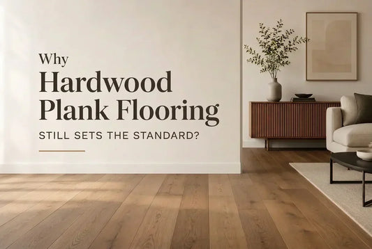 Modern living room featuring natural hardwood plank flooring, minimalist furniture, and warm wood tones, showcasing the timeless appeal of hardwood flooring.