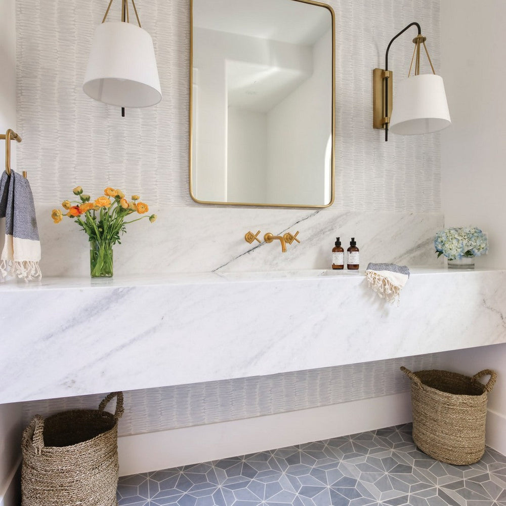A contemporary home bathroom detailed with an intricate Bedrosians Blomma Marble Honed Mosaic installation.